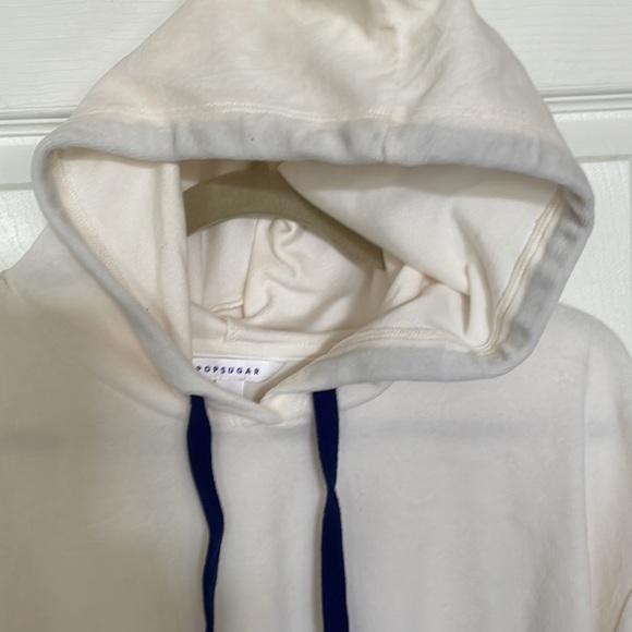 Cream hoodie with navy drawstring and star on left sleeve. Size XL. - Picture 5 of 9